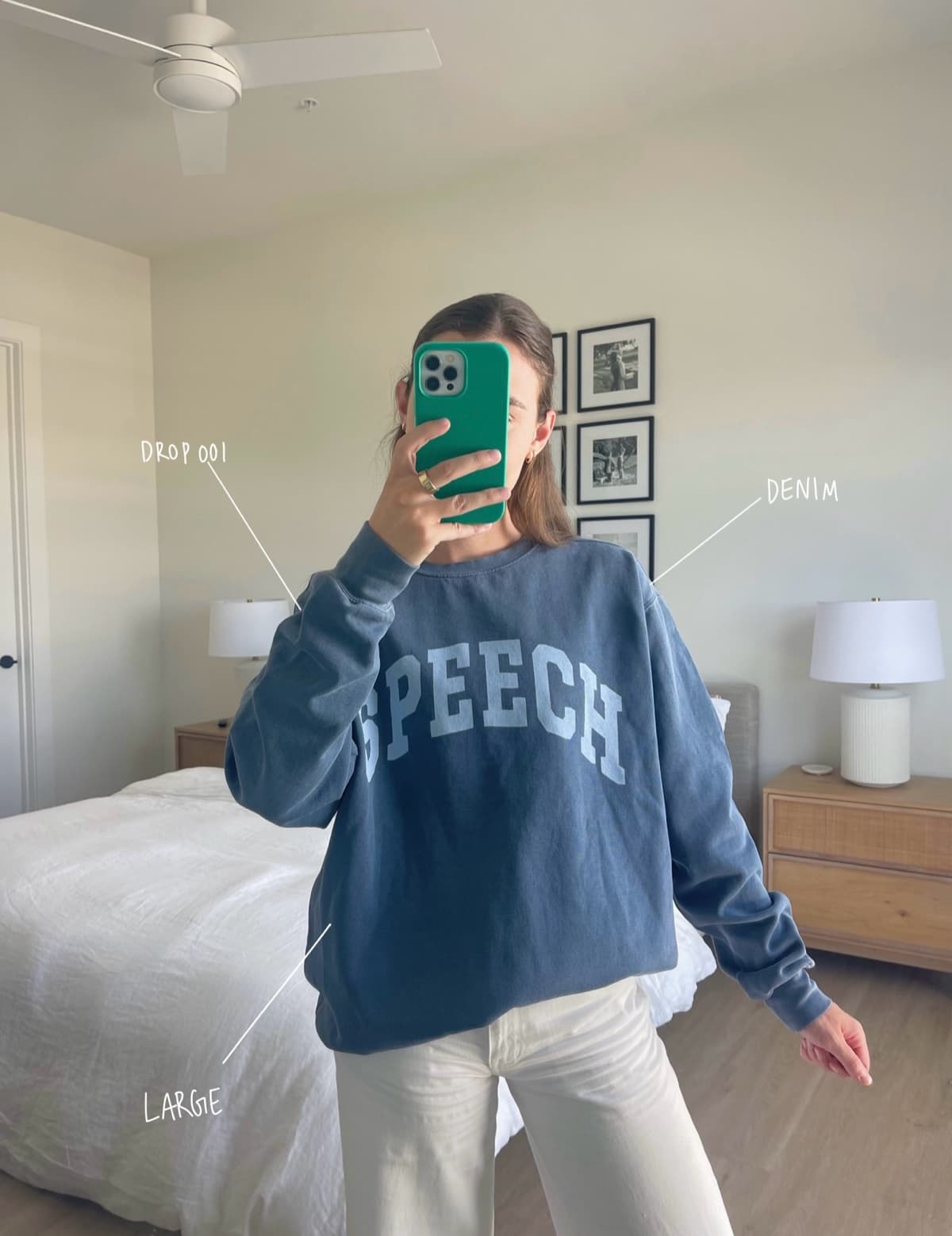 Raney wearing the denim SPEECH crewneck in a size large